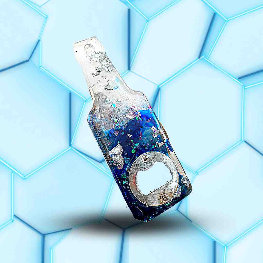Décapsuleur en forme de bouteille bleu et blanc avec des paillettes argentées