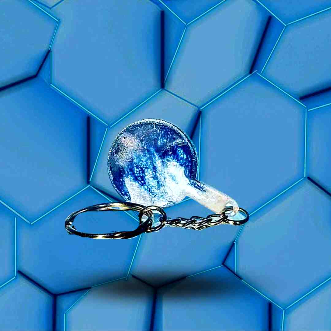 Porte-clés Naruto avec l'Emblème du clan Uchiwa bleu et blanc